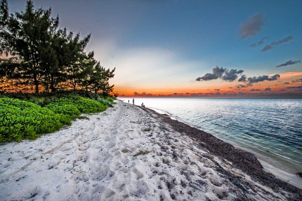 A sunset view of Barkers Beach in West Bay. - Photo: Chris Court